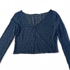 Sheer textured long sleeve top with one button closure. Size M/L